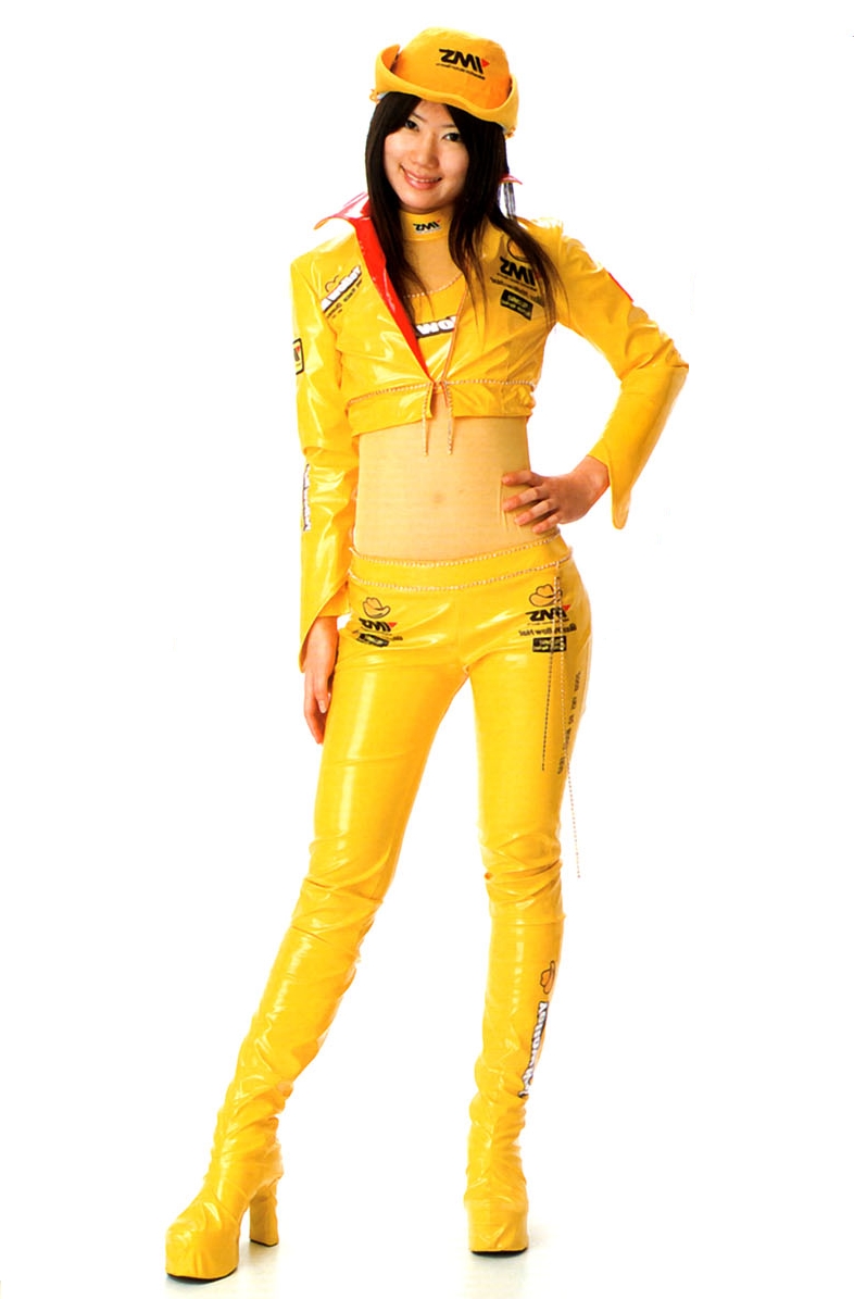Brunette Race Queen wearing Yellow Shiny Pants and Yellow Kneehigh Boots